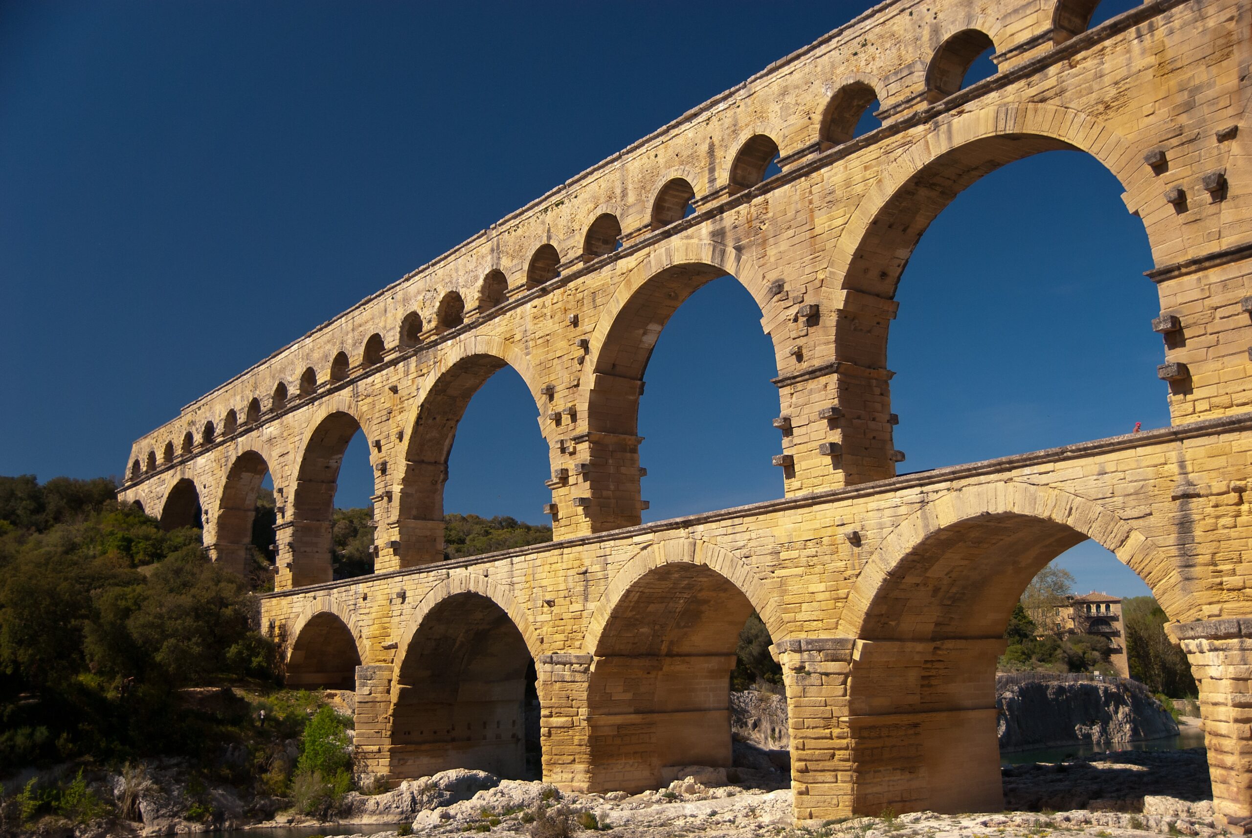 Ancient Roman bridge built with stone arches across a river