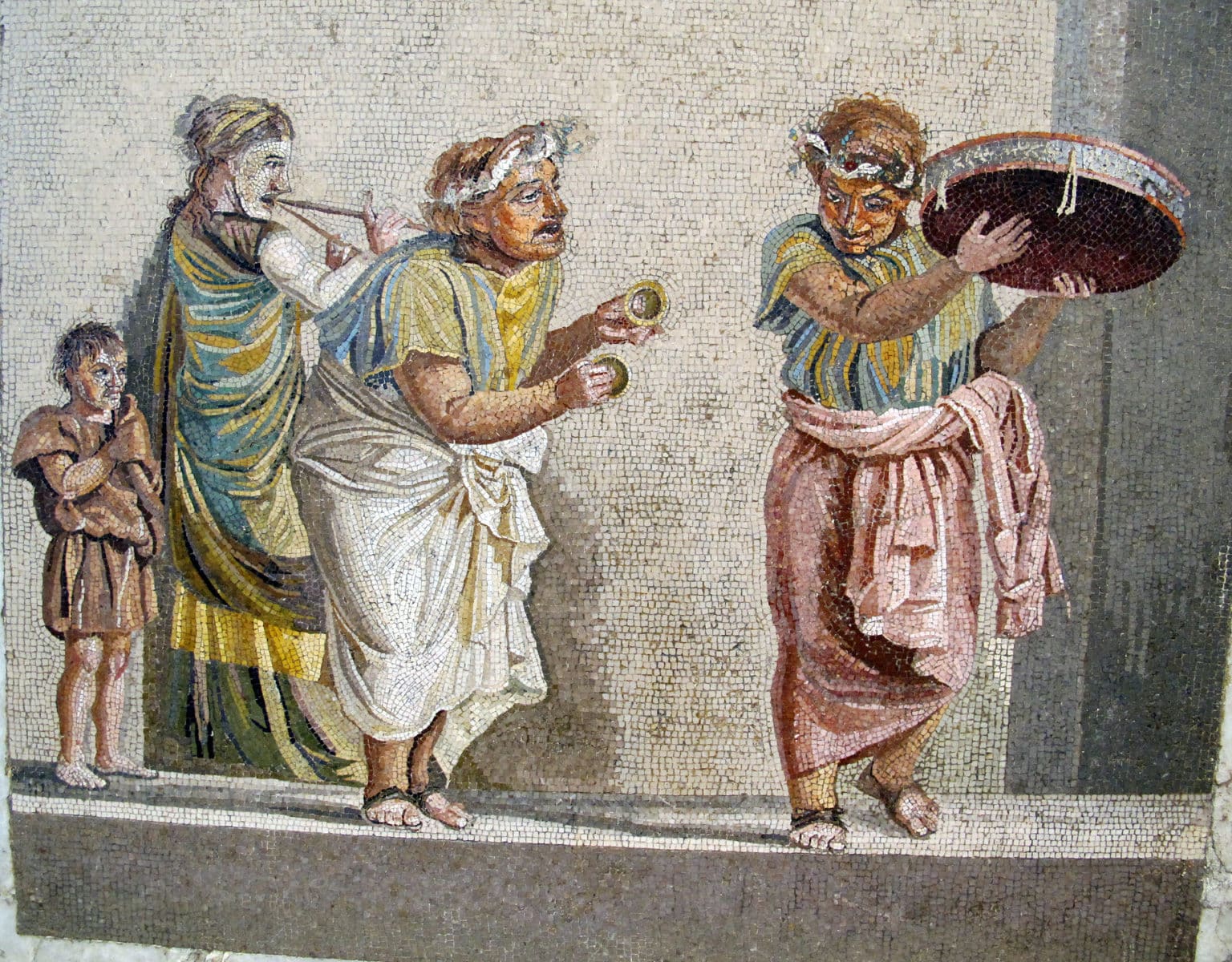 Ancient Roman mosaic showing musicians playing different musical instruments during a lively performance
